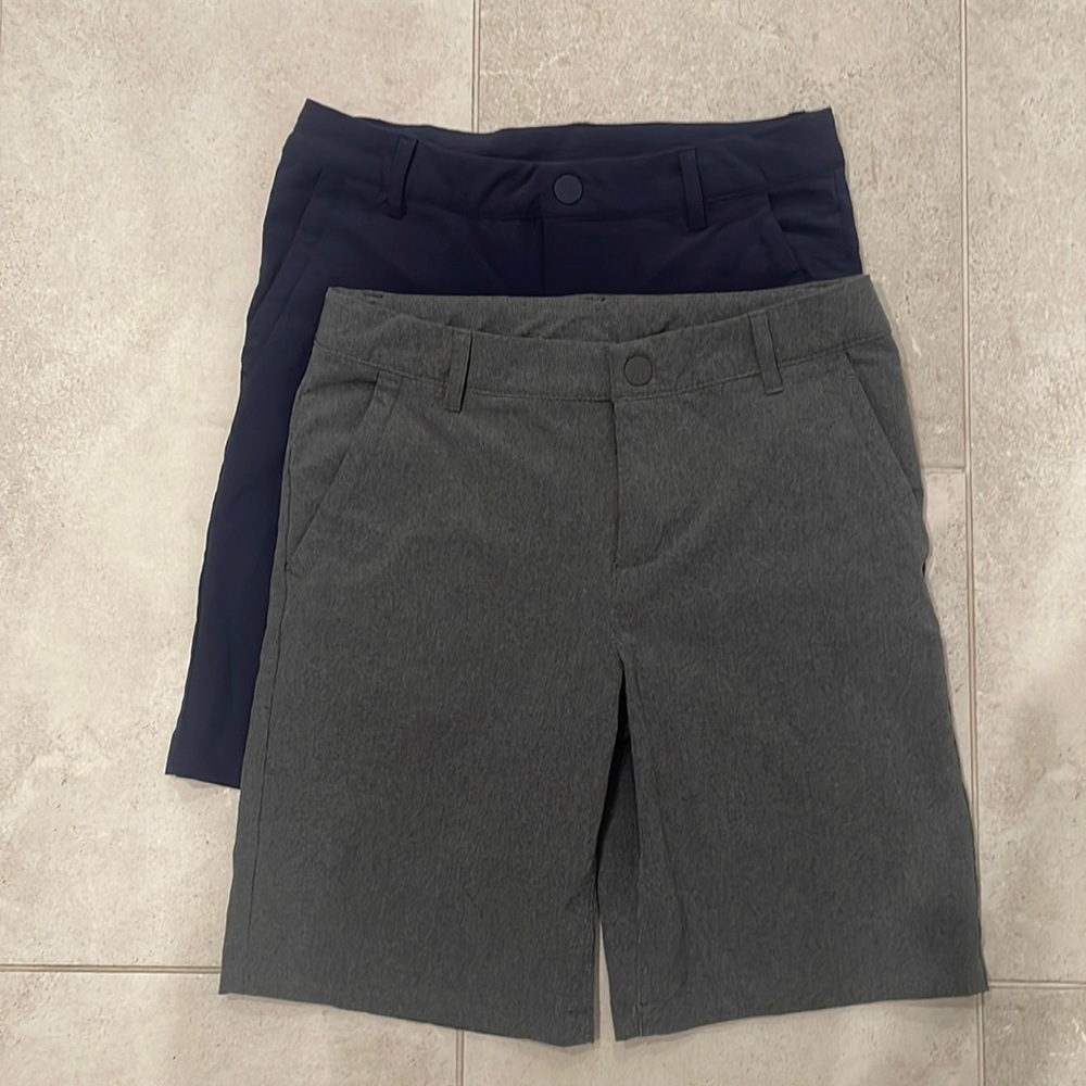 Two pairs of flexible fit golf or uniform shorts by All In Motion.